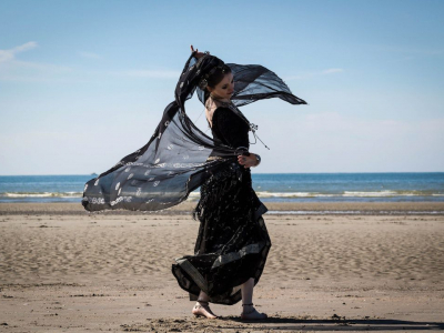 woman dancing on seashore